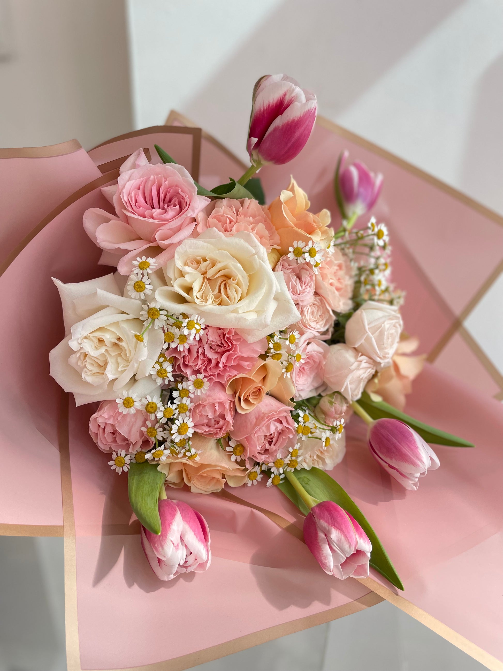 Fun Loving bouquet – pink, peach and off-white roses with chamomile and tulips
