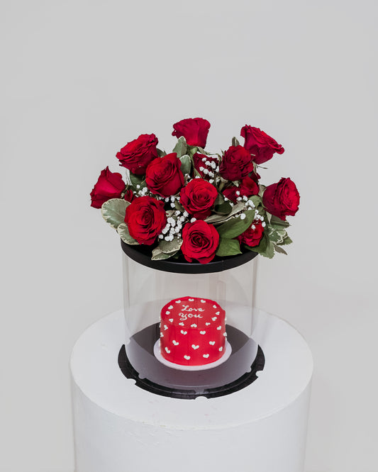 A delectable red Valentine's cake presented in a box, accompanied by a beautiful arrangement of flowers, a sweet and romantic gift for Valentine's Day.