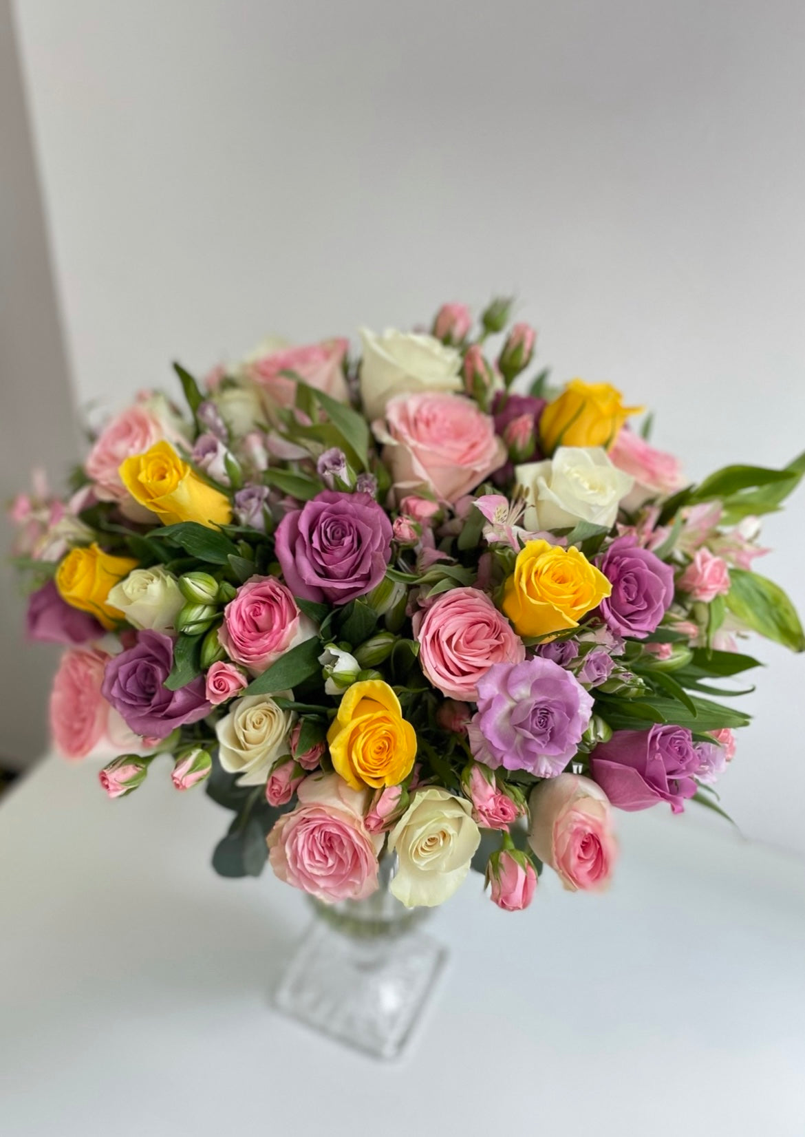 Colourful roses in a vase