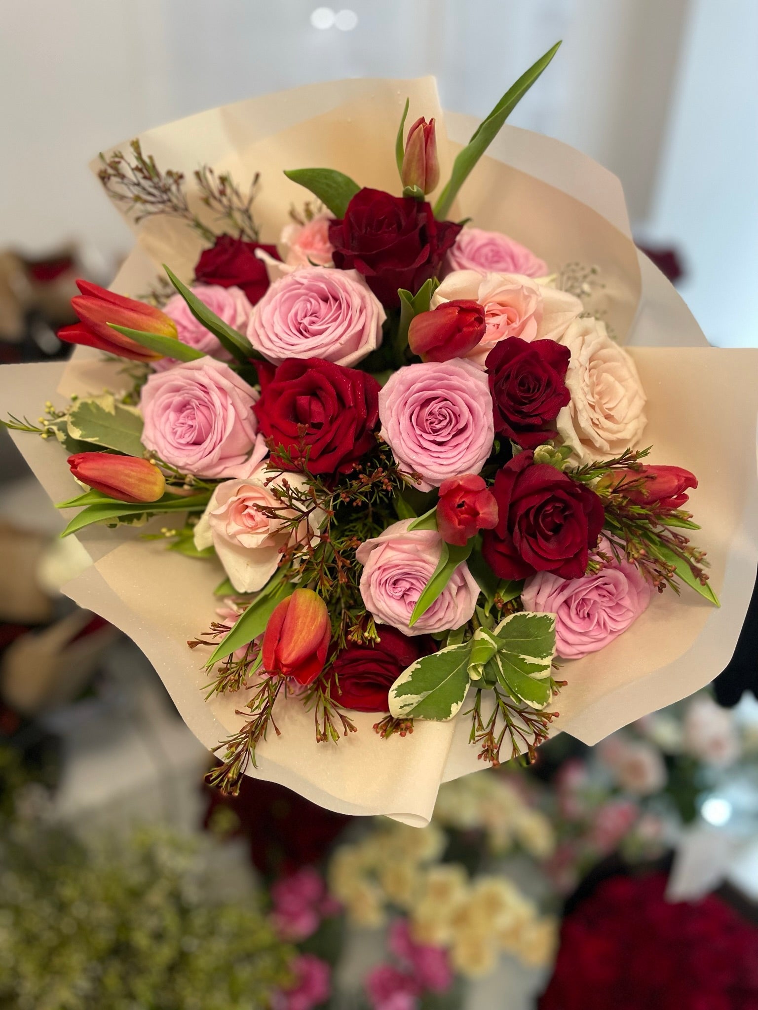 Pink and red roses with tulips