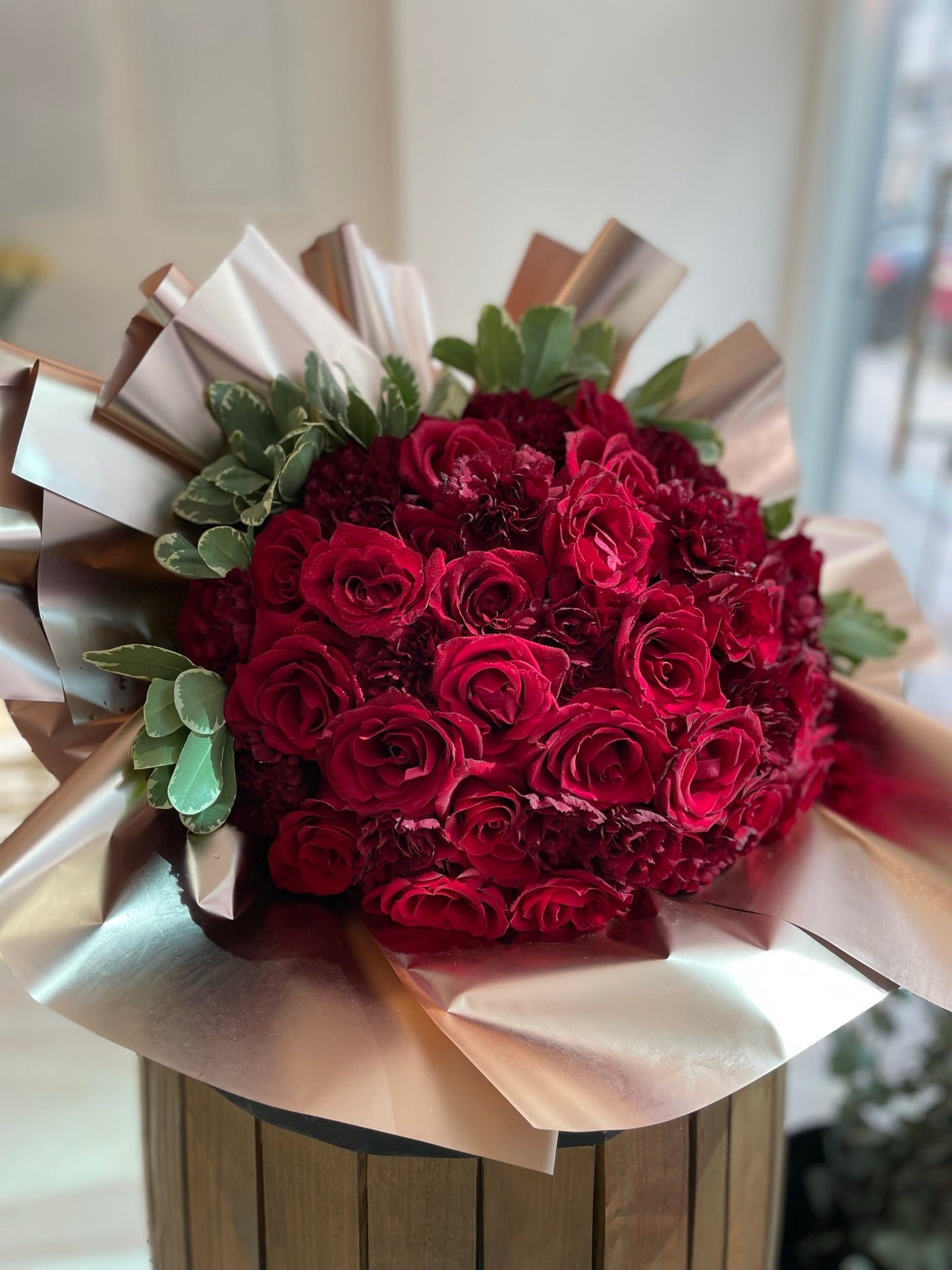 Red roses with rose gold wrapping