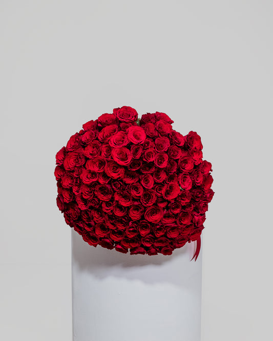 A breathtaking bouquet comprising 100 stunning red roses, a grand gesture of love and adoration for Valentine's Day.
