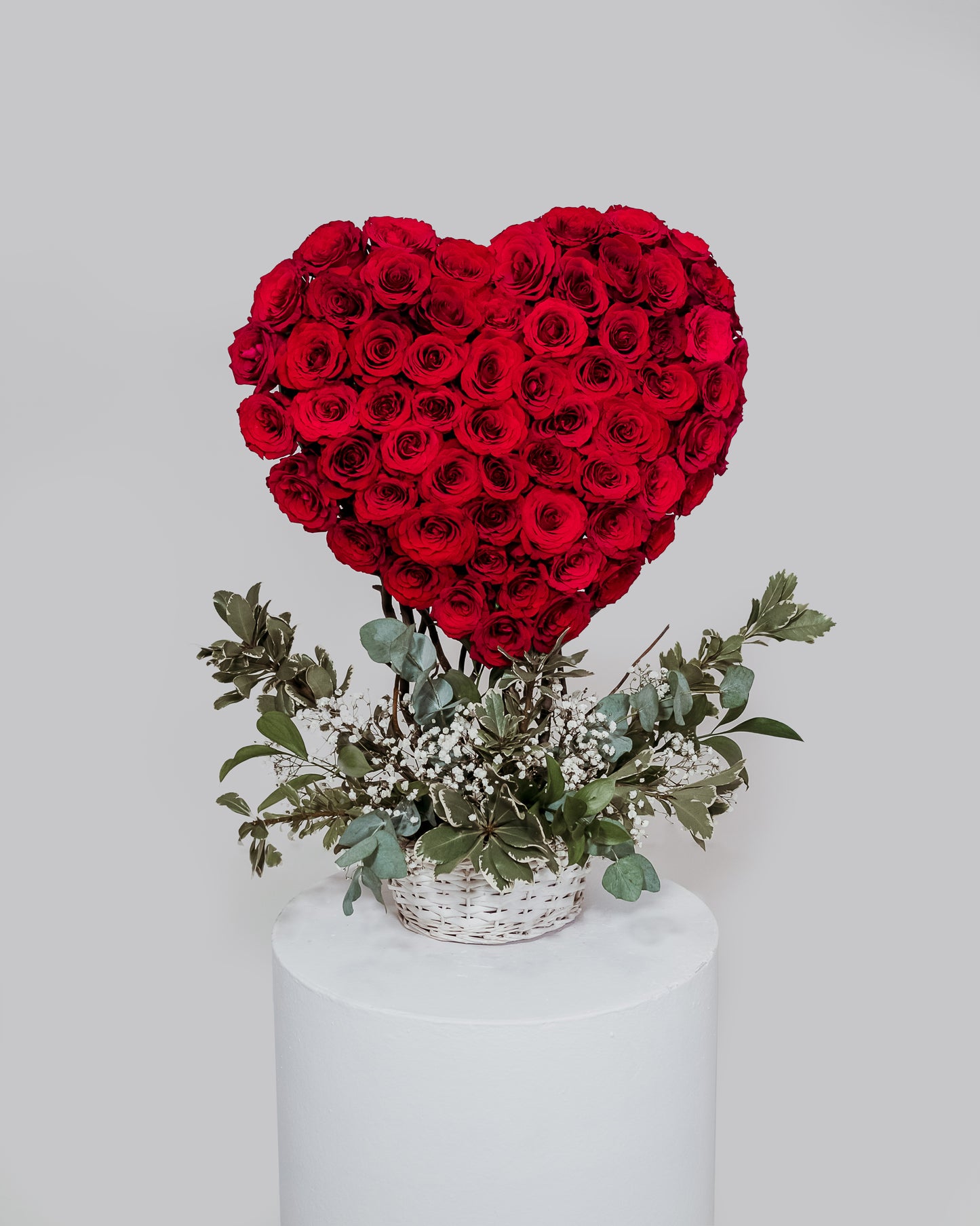 An impressive large 3D heart-shaped arrangement crafted from an abundance of radiant roses, a grand expression of love and devotion for Valentine's Day.