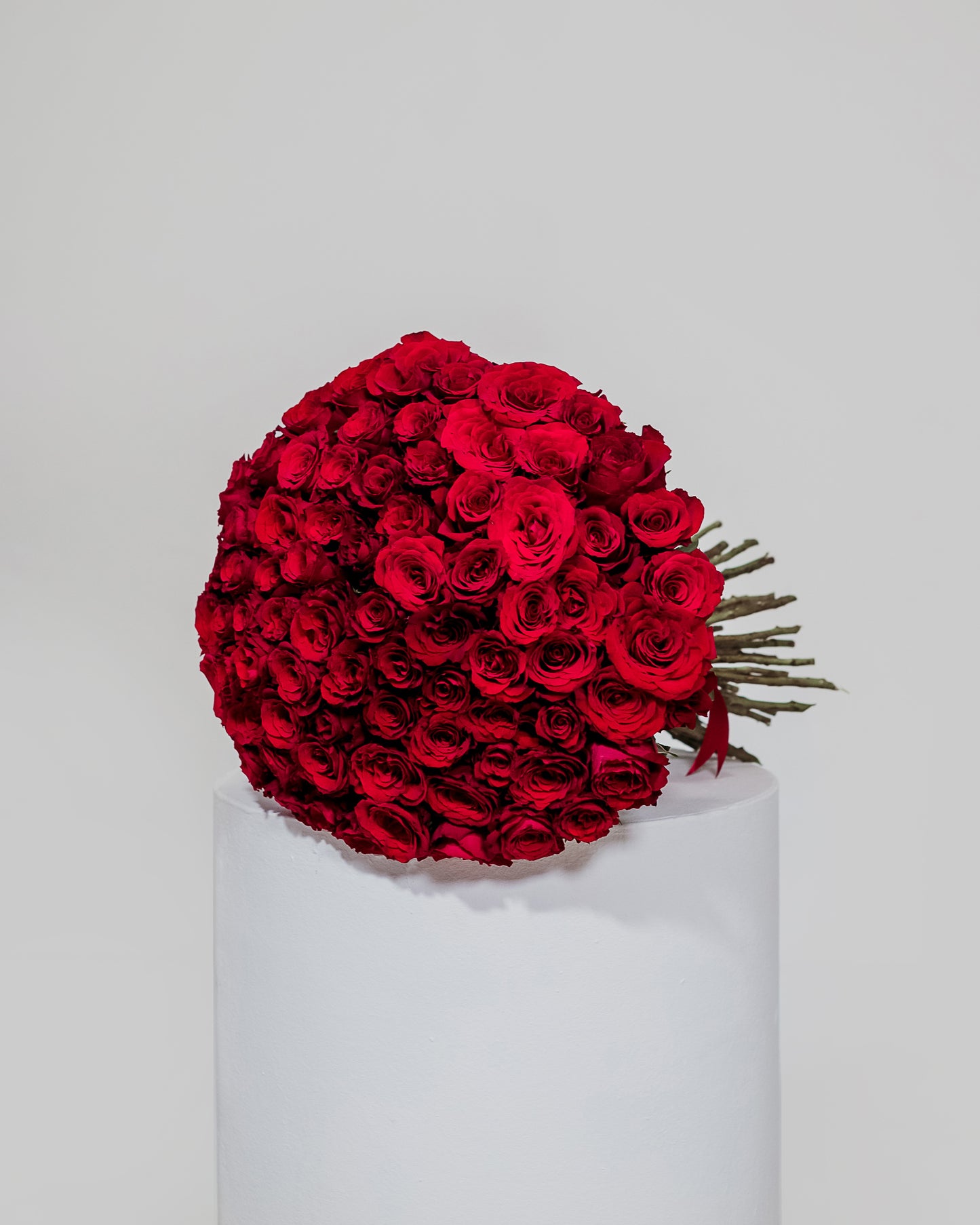 An extravagant bouquet featuring 75 rich red roses, symbolizing deep love and devotion for Valentine's Day.