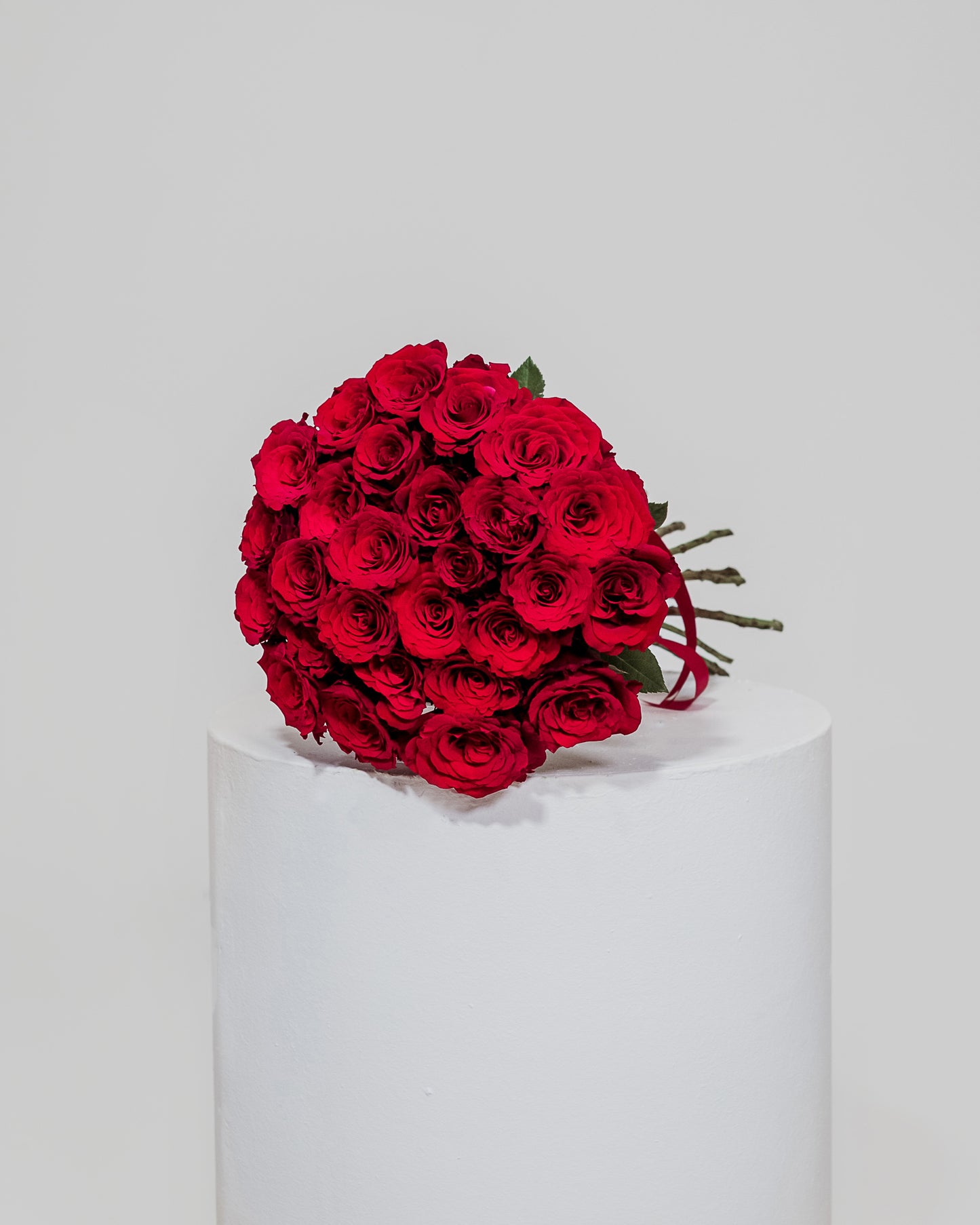 A stunning bouquet of 25 vibrant red roses, perfect for expressing love and romance on Valentine's Day.